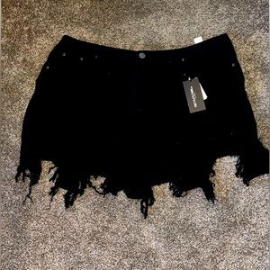 Pretty Little Thing ripped black denim shorts. 22. Never worn.